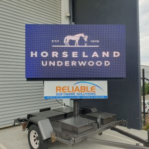 LED trailer sign displaying advertising content
